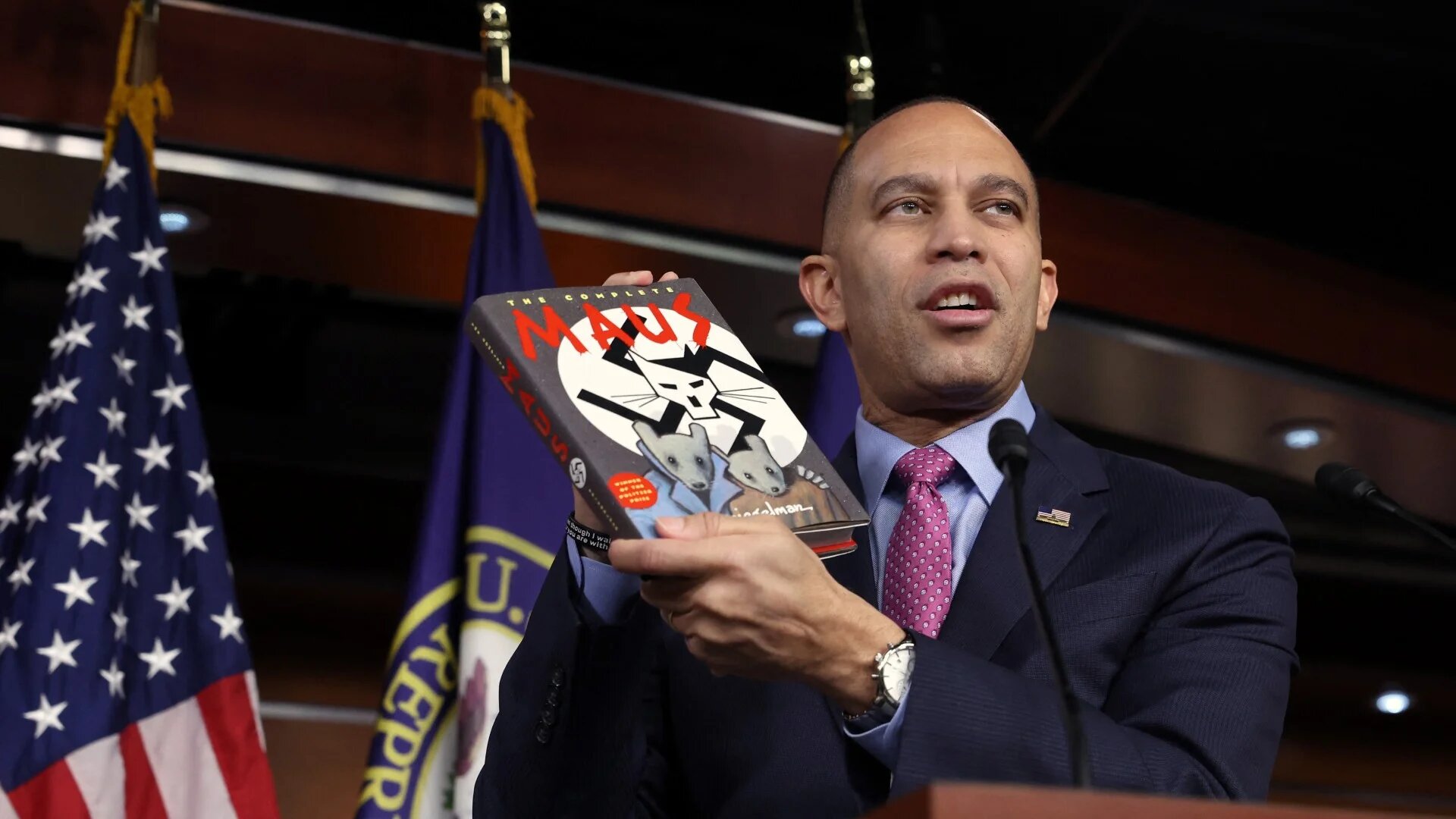 US House Democratic Leader Hakeem Jeffries holds up a copy of Maus by Art Spiegelman, which was recently banned in a Tennessee school district, during a press conference on 24 March 2023 in Washington, DC