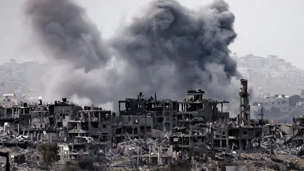 This picture taken on November 12, 2023 from a position along the border with the Gaza Strip in southern Israel shows a smoke plume erupting during Israeli bombardment on the Palestinian enclave amid ongoing battles.