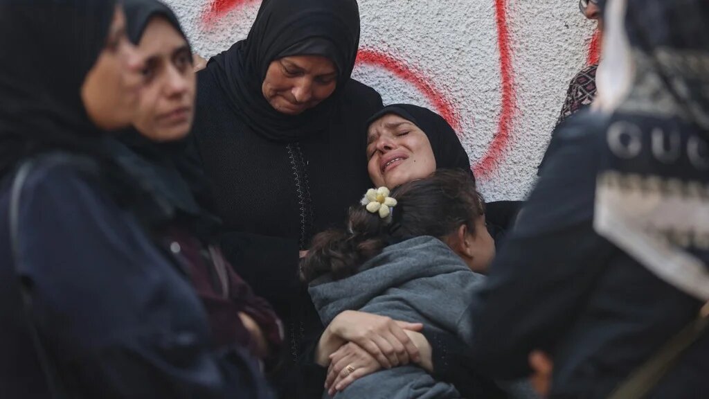 Palestinians mourn the death of loved ones killed in overnight Israeli strikes, at al-Shifa Hospital in Gaza City on 29 October 2025 (Omar al-Qattaa/AFP)