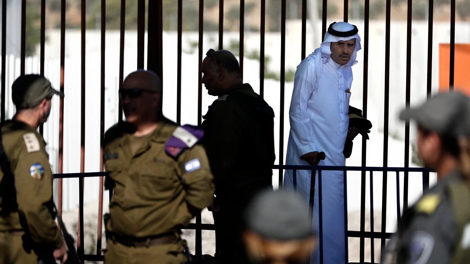 A Palestinian man walks to the Israeli checkpoint between the West Bank town of Bethlehem and Jerusalem on 10 June 2016.