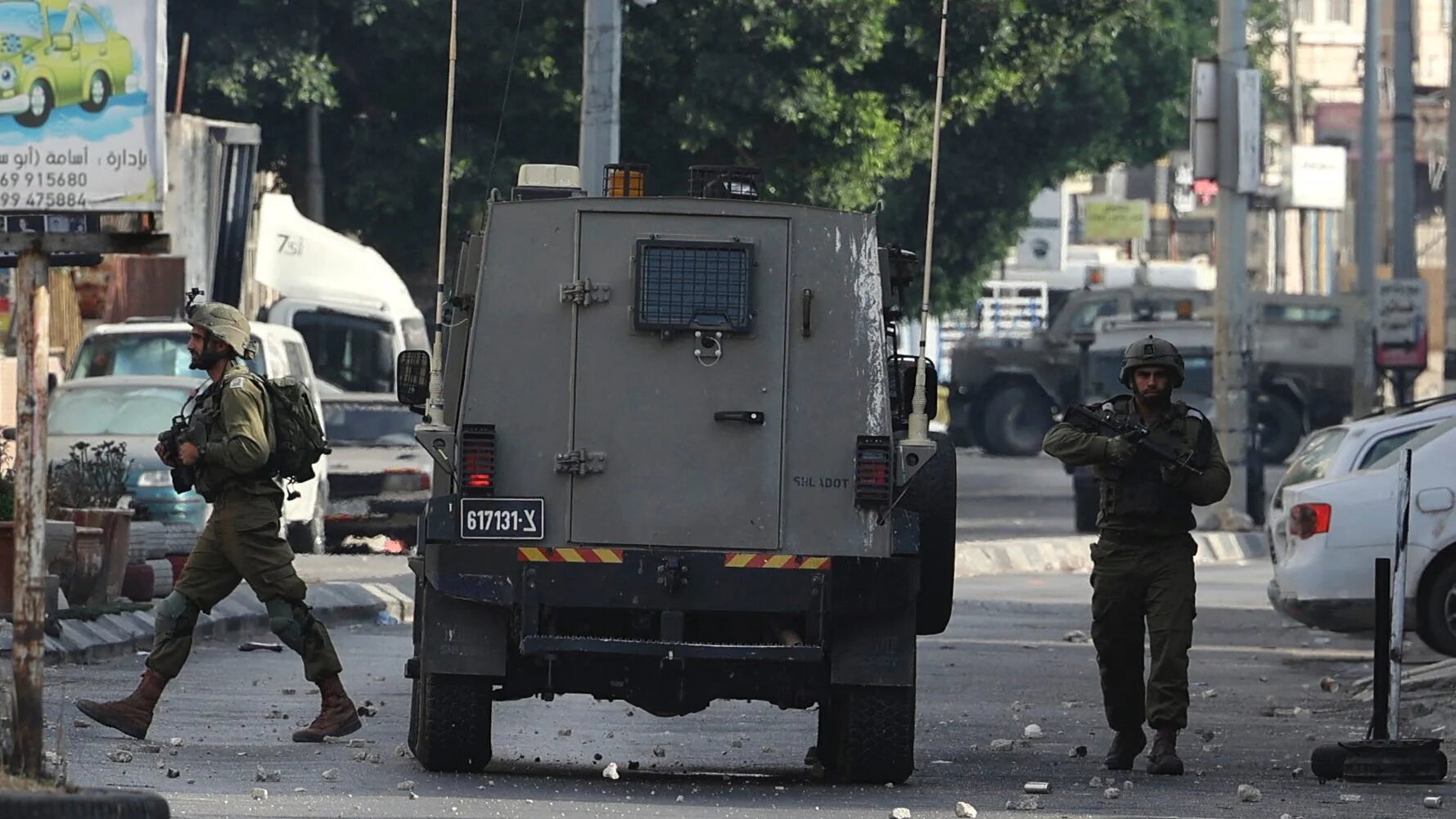 Israeli soldiers stand during a military operation to arrest wanted persons from the Balata camp near the West Bank city of Nablus on 17 August 2022 