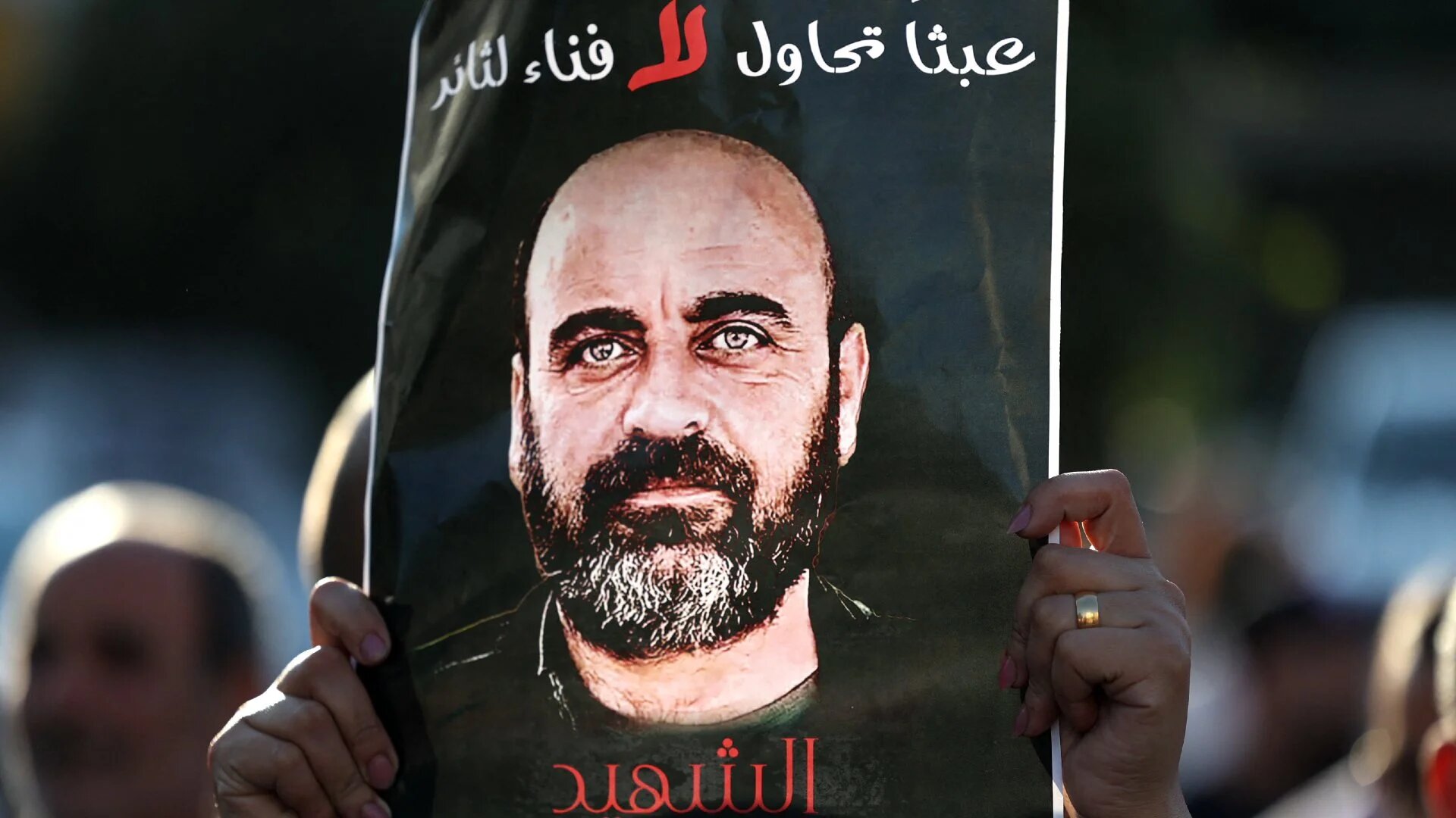 Palestinians rally in Ramallah city in the occupied West Bank on 2 August 2021, denouncing the Palestinian Authority following the death of activist Nizar Banat.