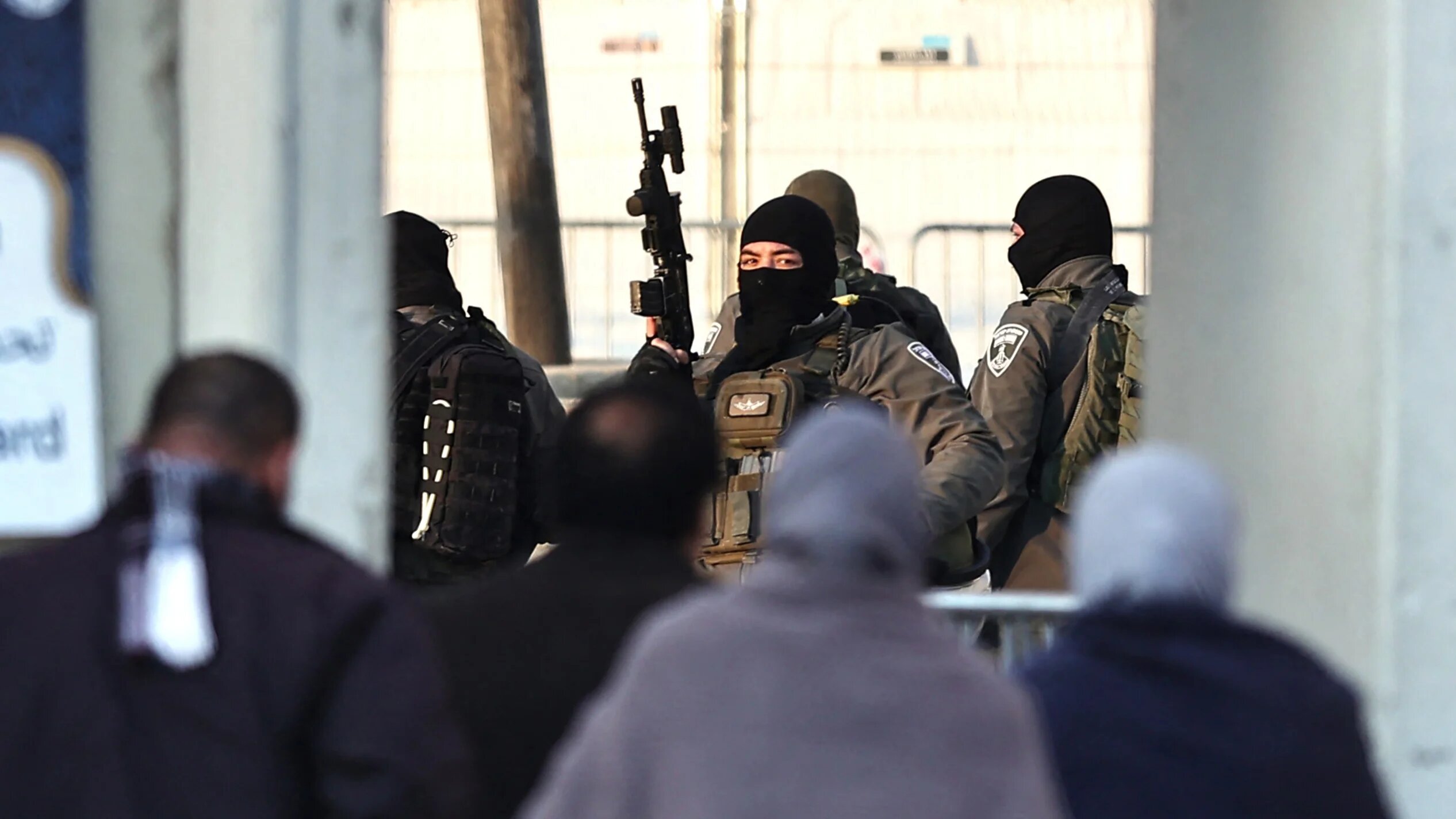 Palestinian Muslims prepare to cross an Israeli checkpoint in Qalandia, in the occupied West Bank, on 22 March, 2024 (AFP/Zain Jaafar)