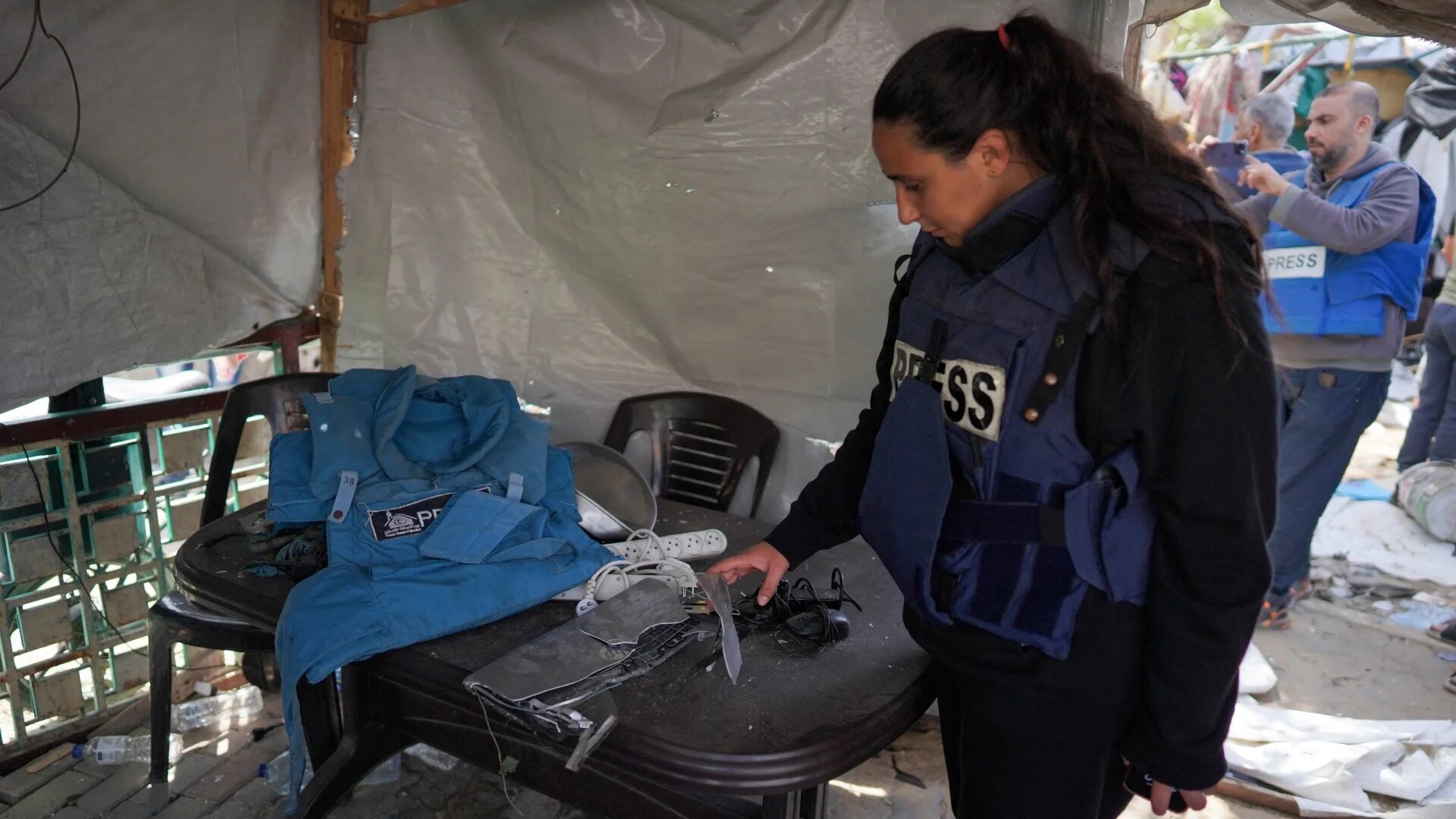 Palestinian journalist Hind Khoudary inspects a tent at a makeshift camp for displaced people in Deir al-Balah in the central Gaza Strip after it was hit by Israel bombardment on 31 March 2024.