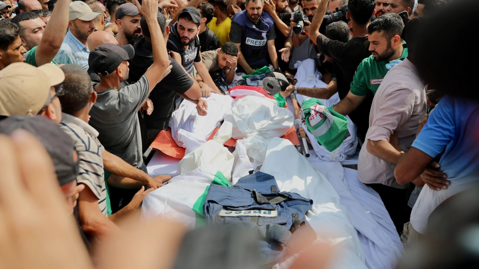 Palestinian journalists and others gather on 11 August 2025 for the funeral of six reporters directly targeted and killed by Israeli forces in a tent a day earlier in Gaza City (Mohammed al-Hajjar/MEE)