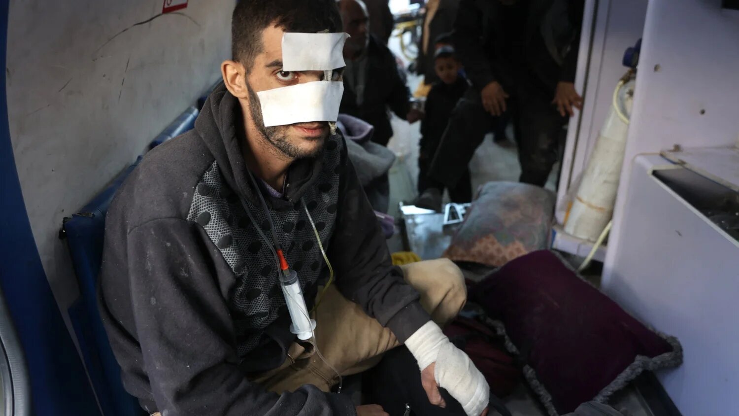 A wounded Palestinian man arrives at al-Shifa Hospital in Gaza City on 28 December 2024 (AFP/Omar al-Qattaa)