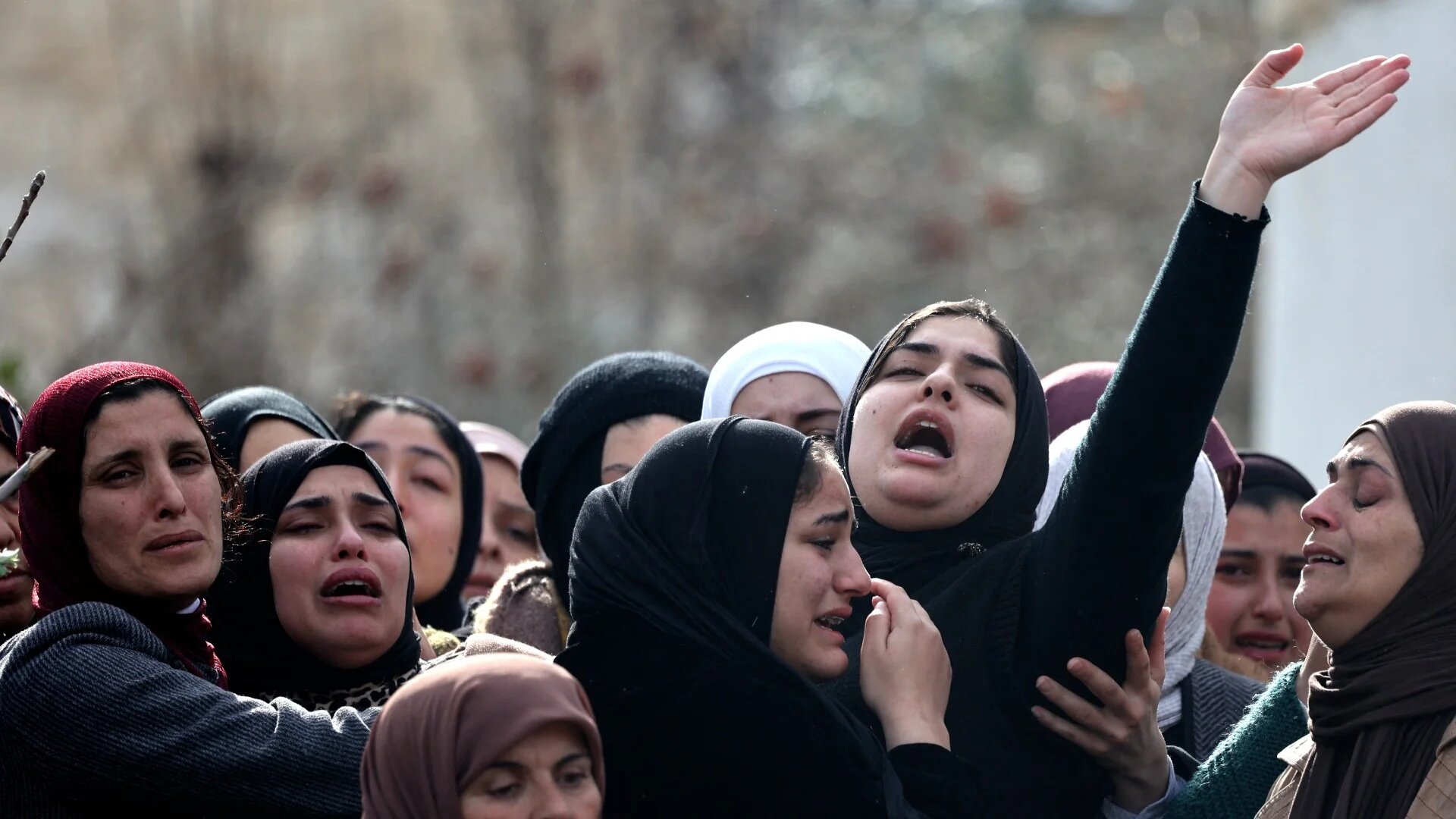 Palestinian relatives mourn the death of Abdel Hadi Nazal, killed during a raid by Israeli forces in Qabatia town, on 13 January 2023 (AFP)