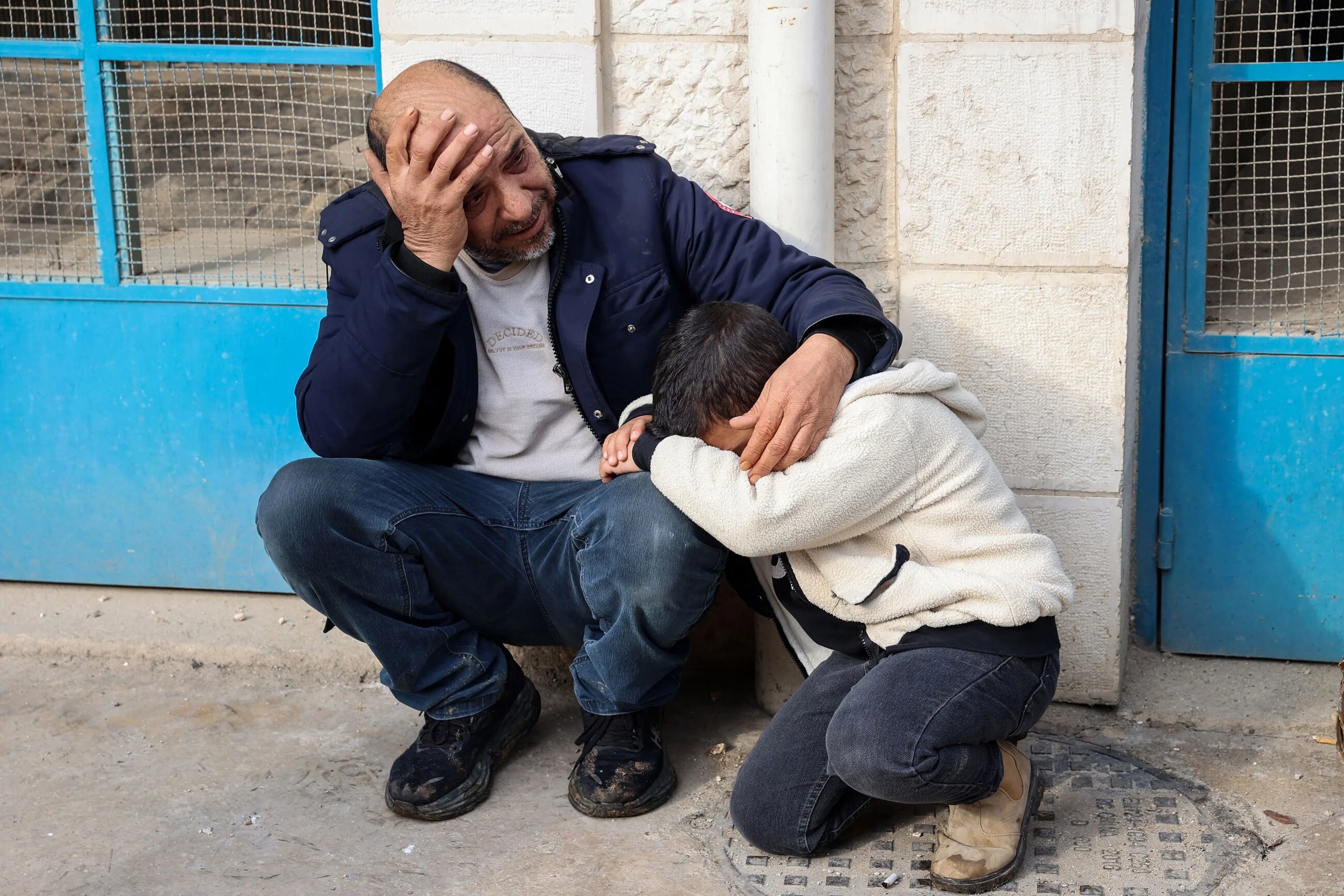 Palestinians mourn outside the Jenin governmental hospital after a several were killed during an Israeli air strike on the occupied West Bank city's refugee camp on 16 January, 2025 (AFP/Zain Jaafar)