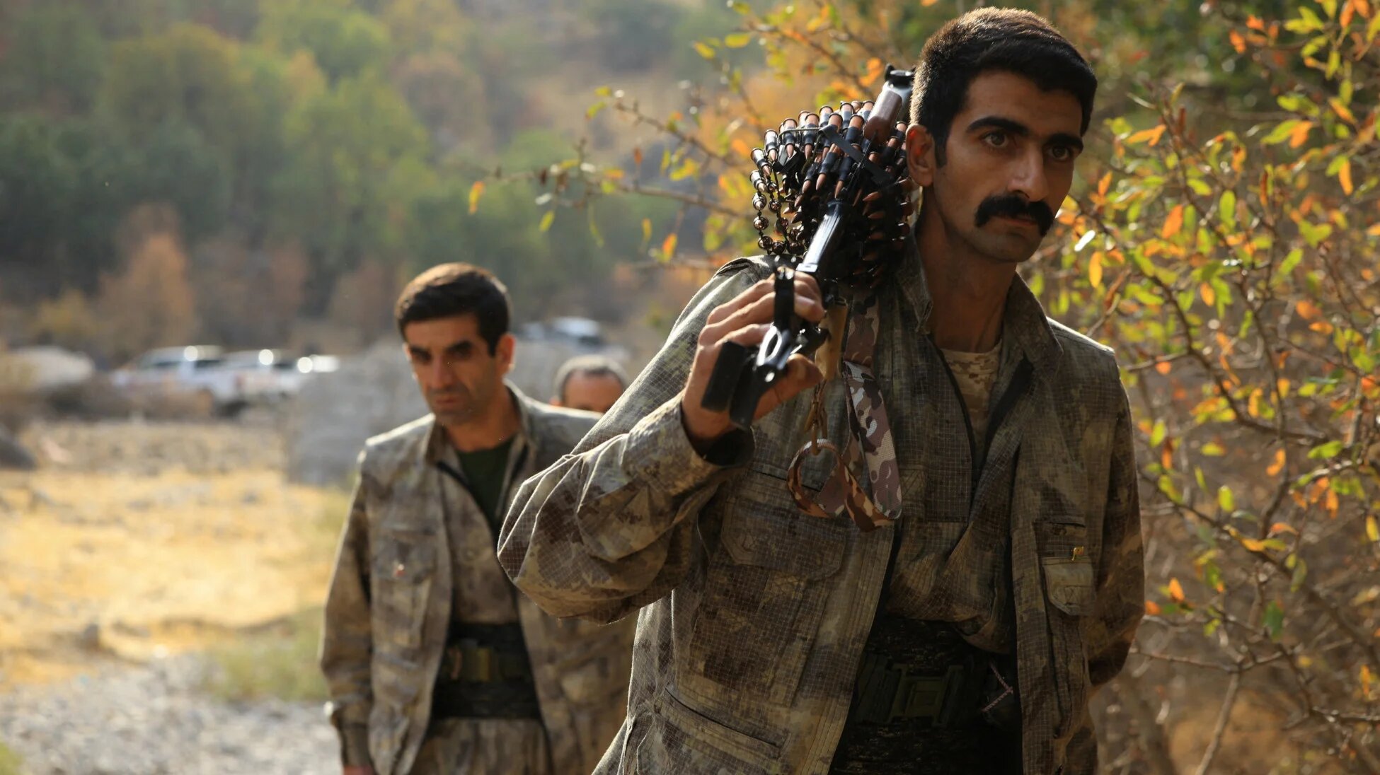 Fighters with the Kurdistan Workers' Party (PKK) walk for a disarmament ceremony in the Qandil mountains, Iraq, 26 October 2025 (Reuters)