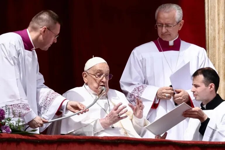 Pope Francis appears on the balcony of St Peter's Basilica on Easter Sunday (Reuters)