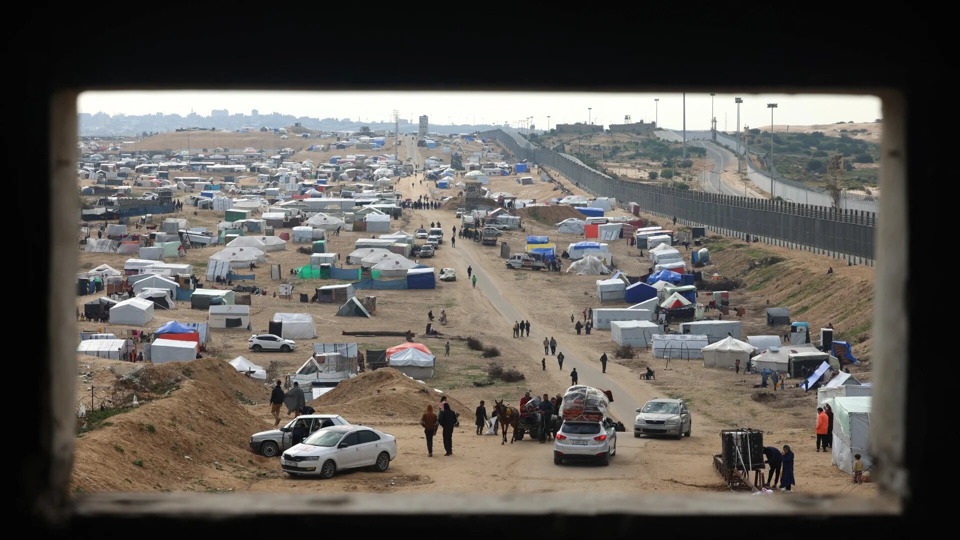 Displaced Palestinians camp near the border fence between Gaza and Egypt, on 16 February 2024 in Rafah, in the southern Gaza Strip (Mohammed Abed/AFP)