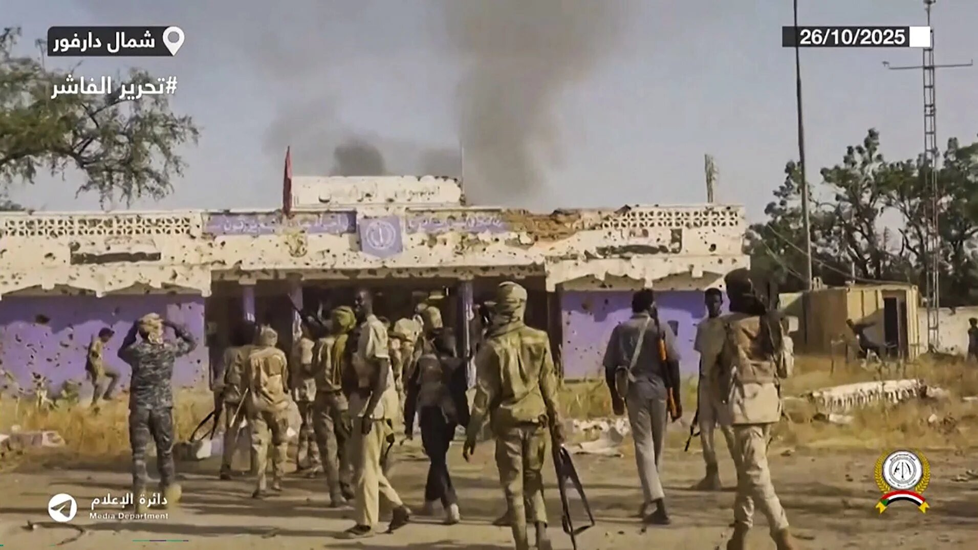 This image grab taken from footage released on Sudan's paramilitary Rapid Support Forces (RSF) Telegram account on 26 October2025 shows RSF fighters in the streets of El-Fasher in Sudan's Darfur (Rapid Support Forces/AFP)
