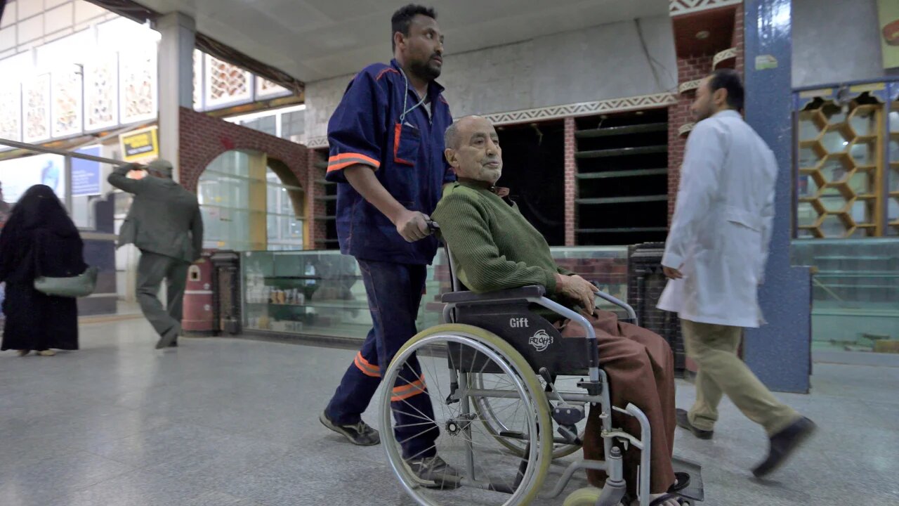 A passenger arrives to take Monday's flight in a country where tens of thousands of patients are on a waiting list seeking to travel abroad (AFP)