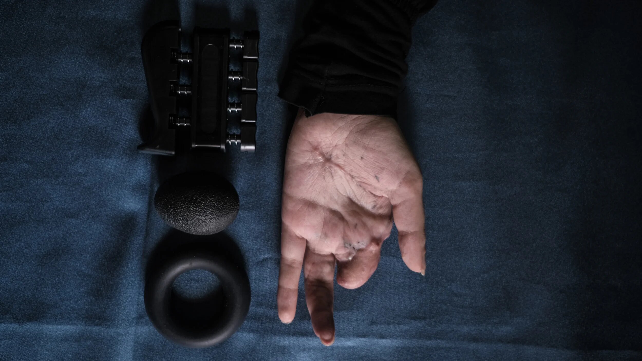 Sarah Jaffal's hands were maimed in the pager attack. She is now relearning how to use them at a physiotherapy clinic in south Lebanon (Joao Sousa/MEE)