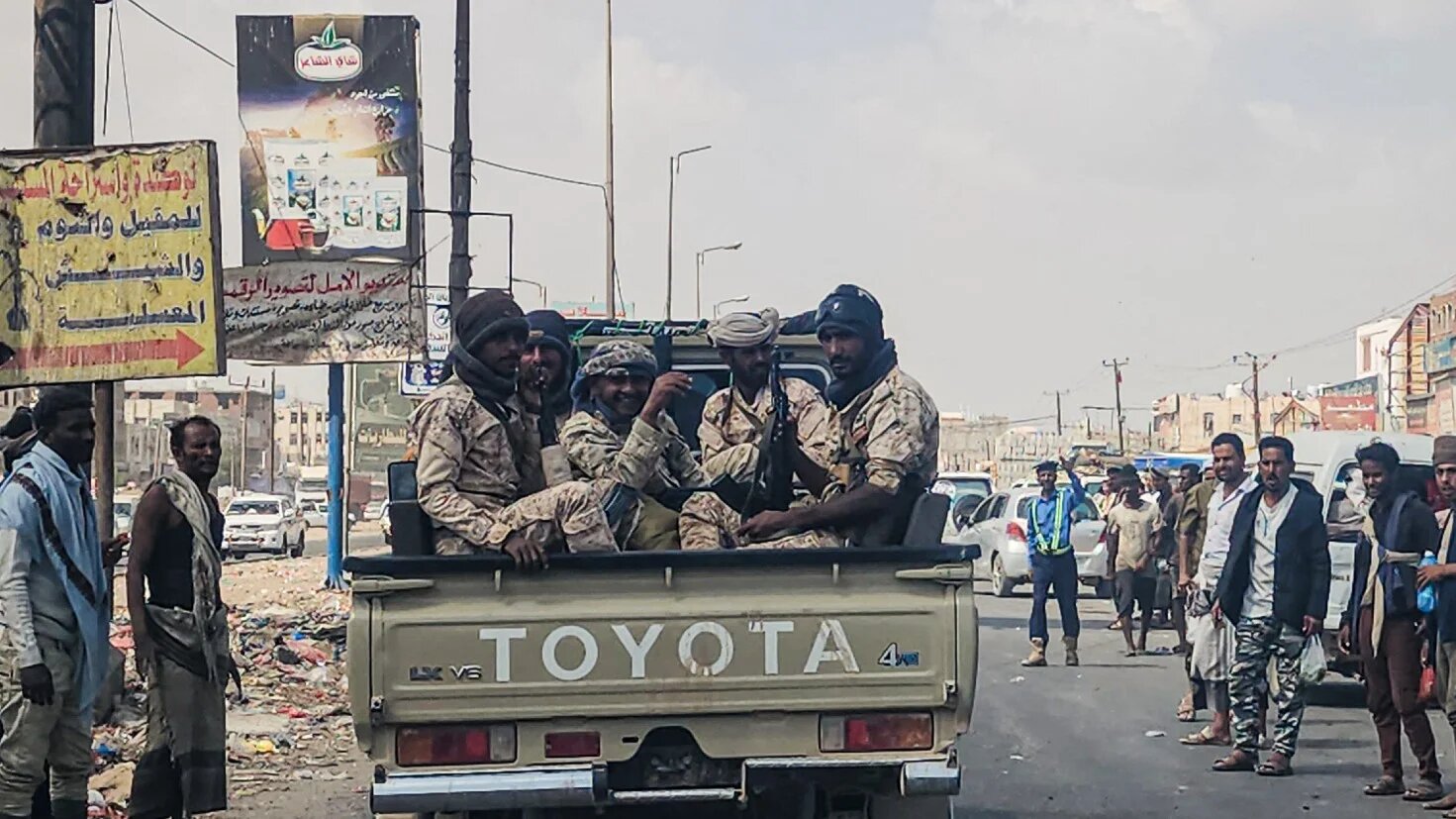 Fighters said to be backed by the Saudi-led coalition drive through the streets of the port city of Aden on 8 January 2026, the day after it was announced that Yemen's separatist leader had fled to the United Arab Emirates (AFP/file photo)