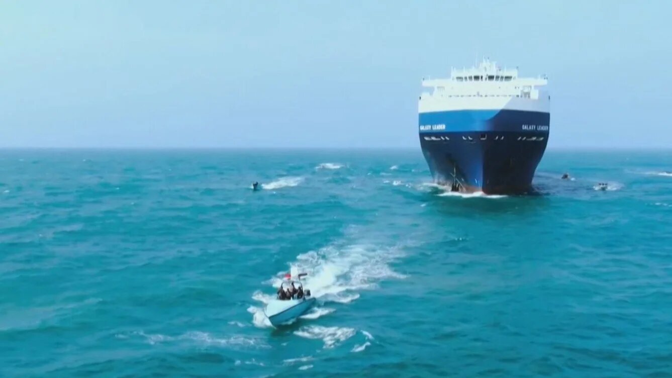 A grab from handout footage released by Yemen's Houthi Ansarullah Media Centre on 19 November 2023, reportedly shows members of the group during the capture of an Israel-linked cargo vessel at an undefined location in the Red Sea (AFP)