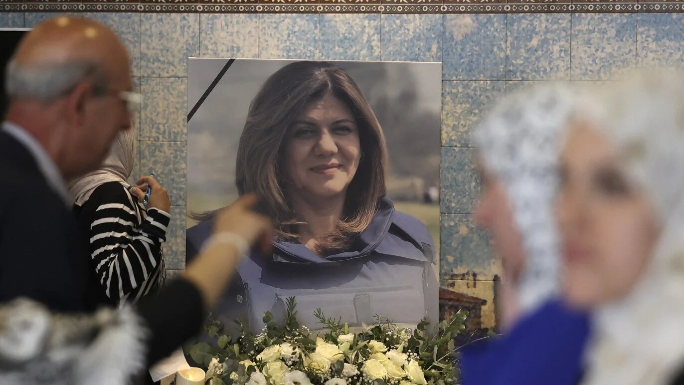 Mourners attend a memorial ceremony for Shireen Abu Aqleh, to mark the 40th day of the killing of the Al Jazeera journalist, in the West Bank city of Ramallah on 19 June 2022.