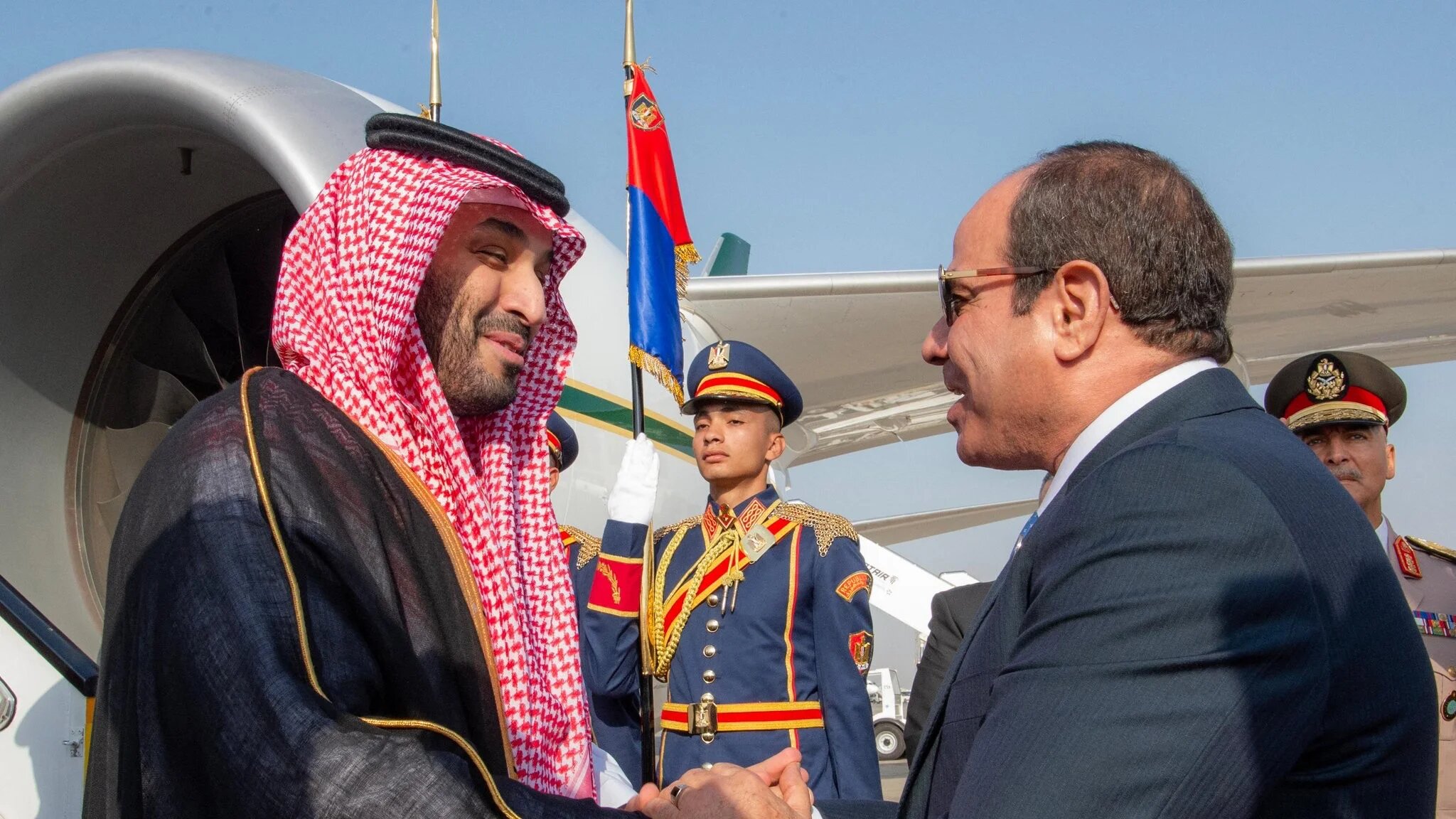A handout picture provided by the Saudi Press Agency (SPA) shows Saudi Crown Prince Mohammed bin Salman (L) being welcomed by Egypt's President Abdel Fattah el-Sisi upon his arrival in Cairo on 15 October 2024 (SPA/AFP)