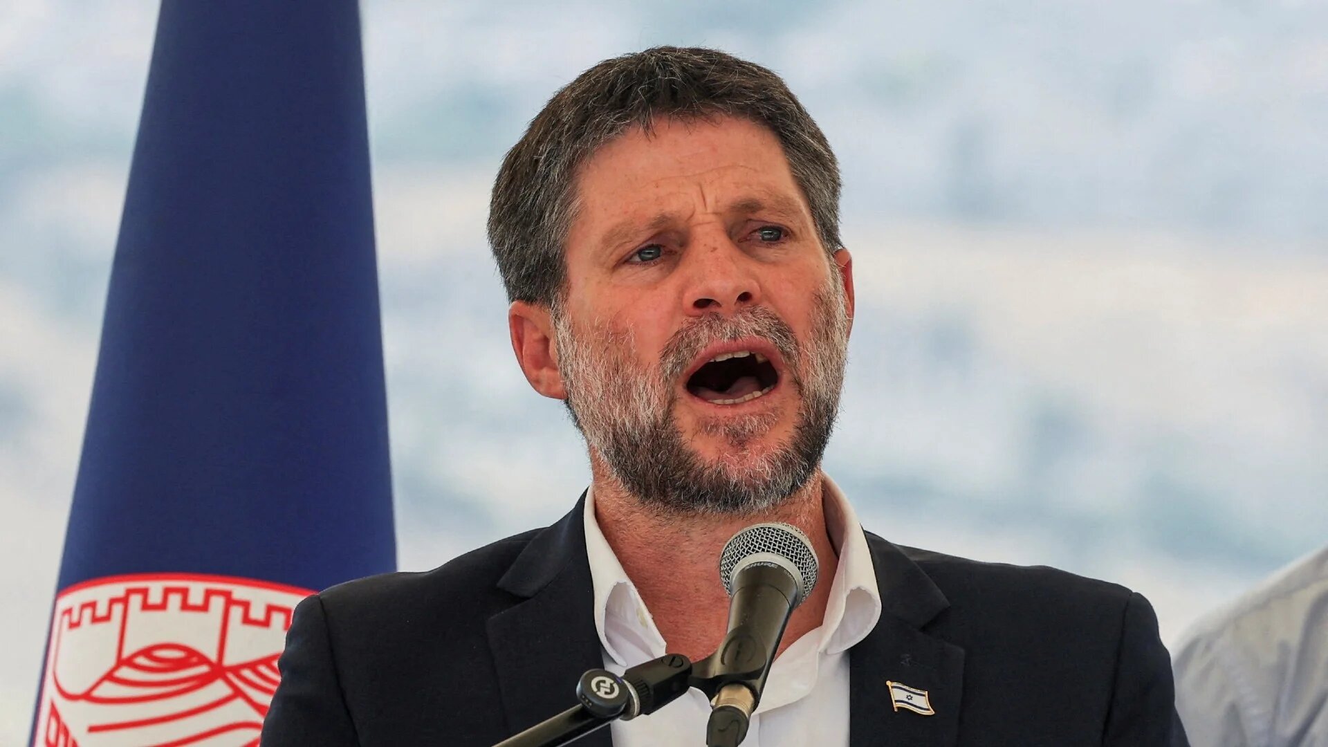Israeli Finance Minister Bezalel Smotrich speaks at a news conference near the Israeli settlement of Maale Adumim in the occupied West Bank, 14 August 2025 (Reuters/Ronen Zvulun)