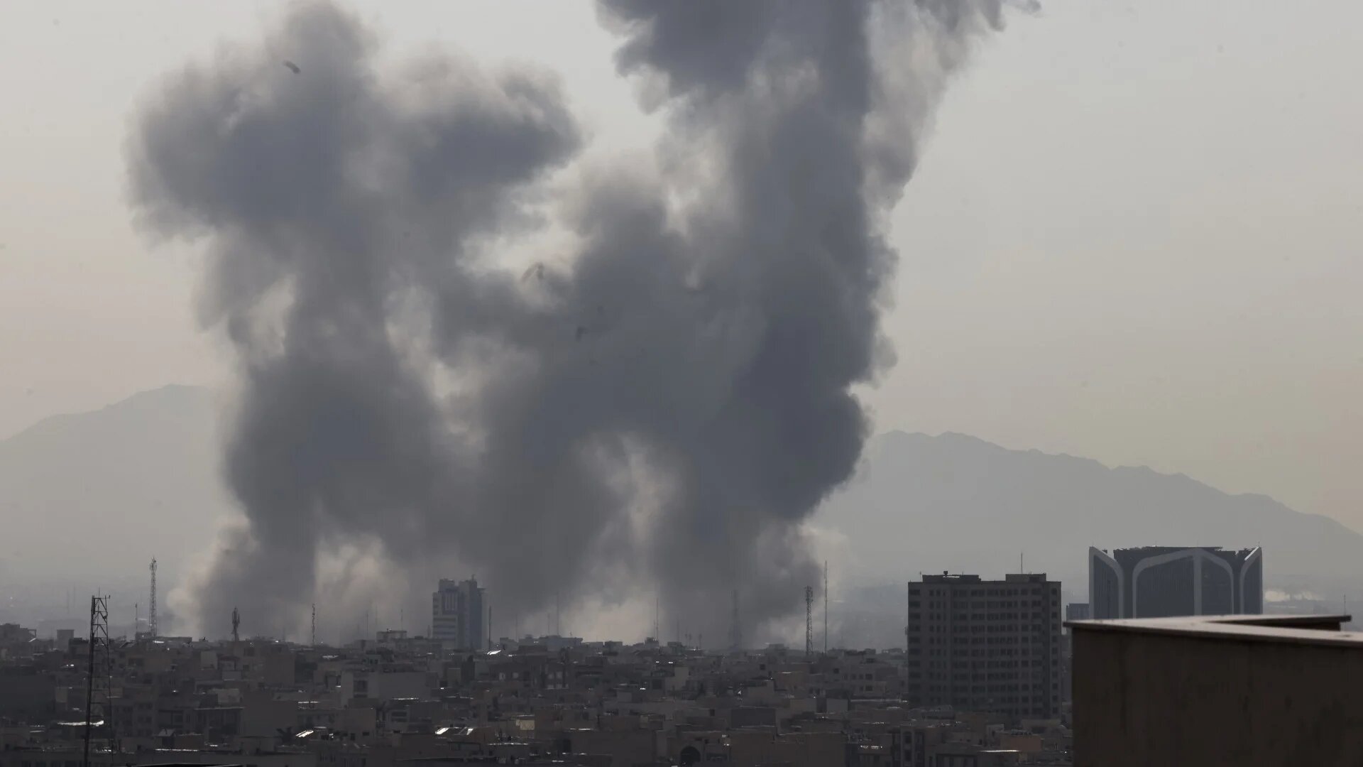 A plume of smoke rises following a reported explosion in Tehran on 28 February 2026 (AFP/Atta Kenare)