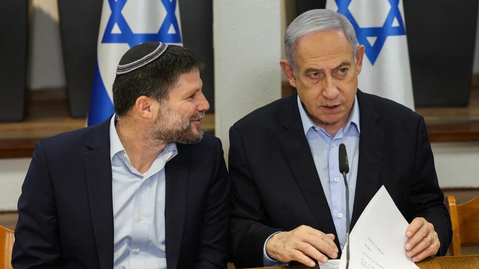 Israeli Prime Minister Benjamin Netanyahu and Minister of Finance Bezalel Smotrich at the Defence Ministry in Tel Aviv on 7 January 2024 (AFP/Ronen Zvulun)