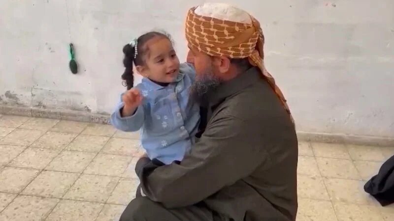 Gaza-KhaledNabhanHoldsGrandaughter-NOV2023-X