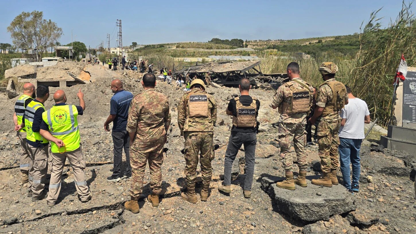 Lebanese army soldiers and first responders inspect the site of Israeli strikes that targeted the Qasmiyeh bridge built over the Litani River in the southern Lebanon on 16 April 2026 (Kawnat Haju/AFP)