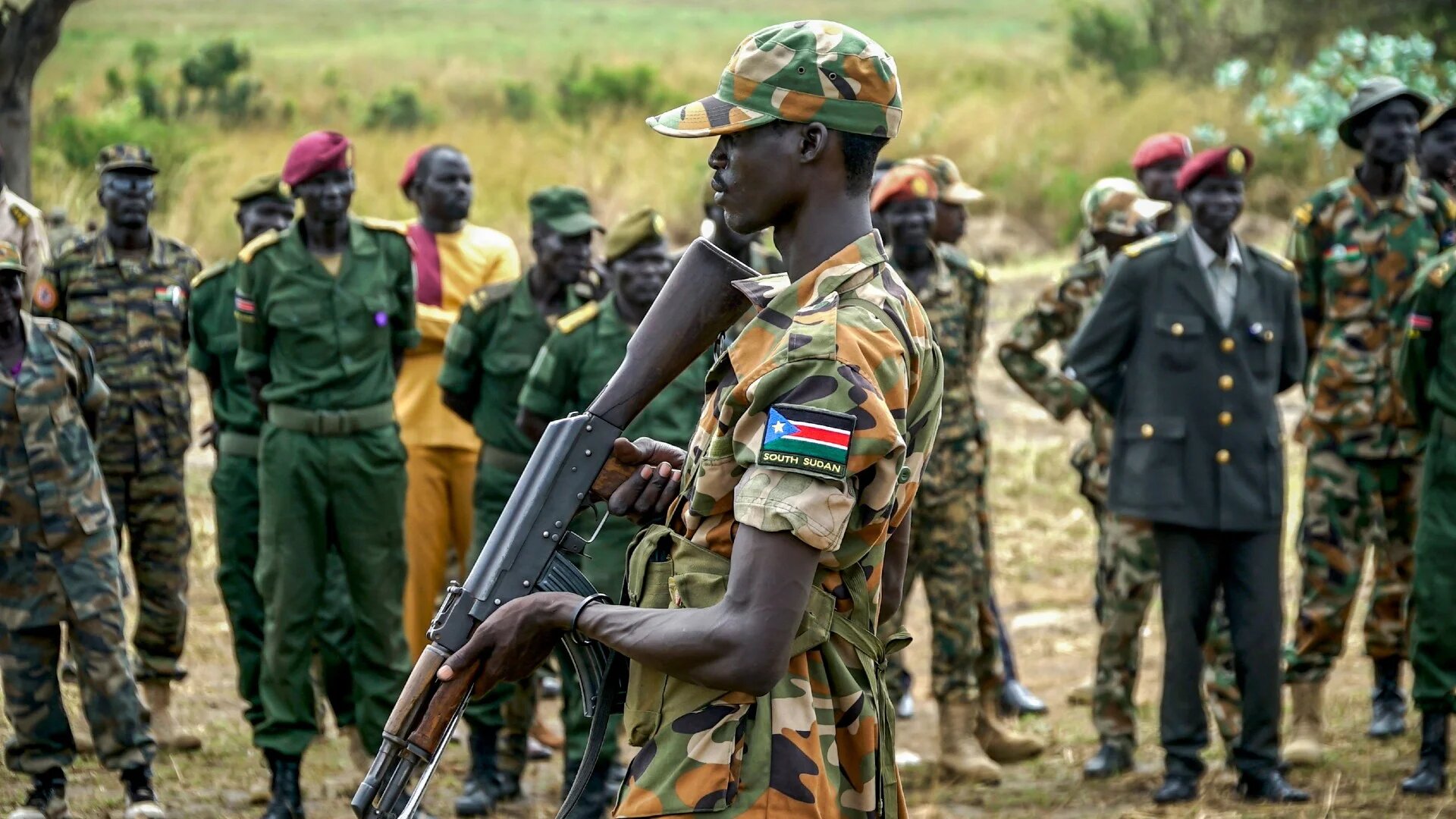In this file photo, a South Sudanese soldier monitors the area as troops belonging to the South Sudanese Unified Forces take part in a deployment ceremony at the Luri Military Training Centre in Juba on 15 November 2023 (AFP)