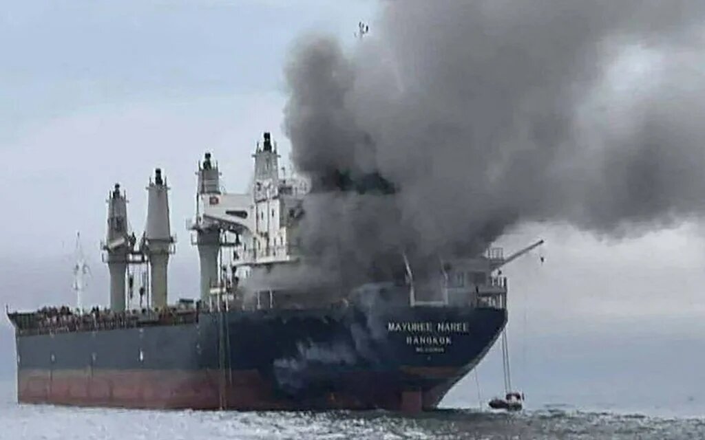Smoke rises from a ship after an attack near the Strait of Hormuz, amid the US-Israeli conflict with Iran, on 11 March 2026 (Royal Thai Navy/AFP)
