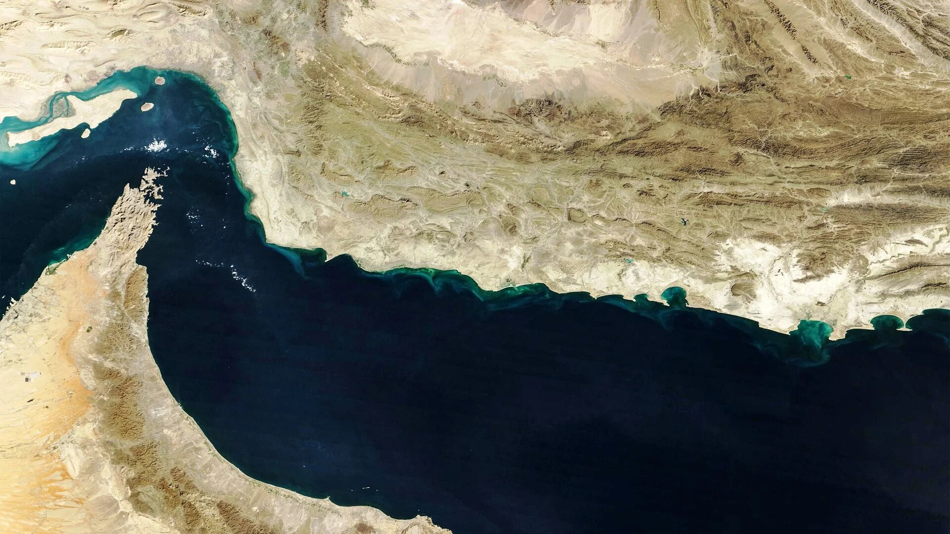 This handout natural-colour image acquired with MODIS on Nasa’s Terra satellite taken on 5 February 2025 shows the Gulf of Oman and the Makran region (C) in southern Iran and southwestern Pakistan, and the Strait of Hormuz (L) and the northern coast of Oman (Nasa Earth Observatory/AFP)