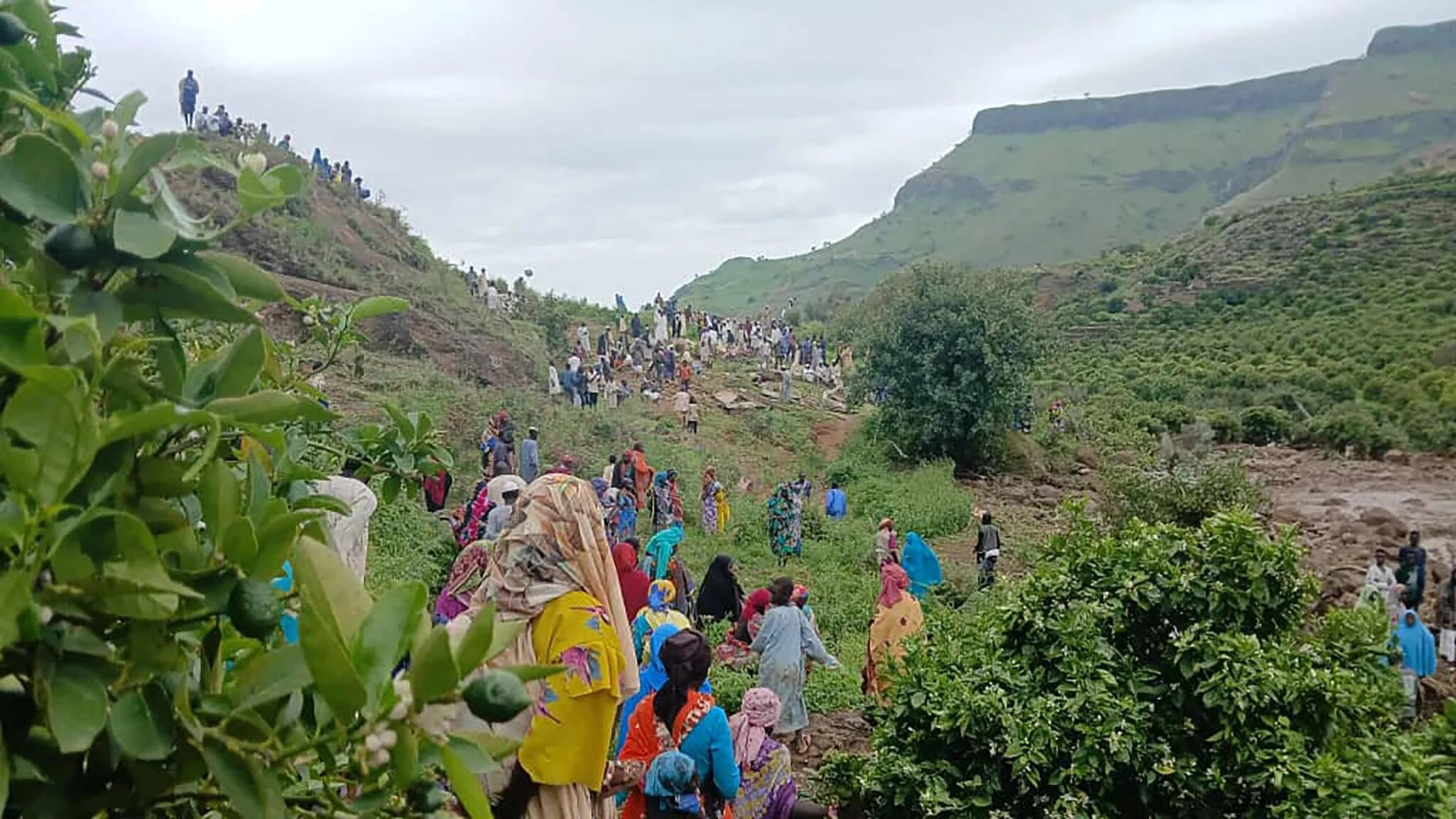 People gather at the scene of a landslide that wiped out the village of Tarsin in Darfur (Sudan People’s Liberation movement/Abdul Wahid faction)
