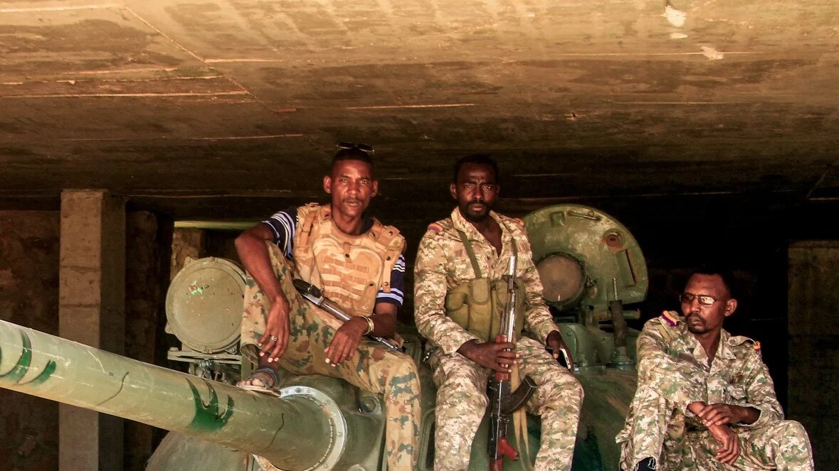 Sudanese army soldiers sit on a tank after capturing a Rapid Support Forces (RSF) base following the paramilitaries' evacuation from the Salha area of Omdurman, Sudan, on 26 May 2025 (File photo/AFP)