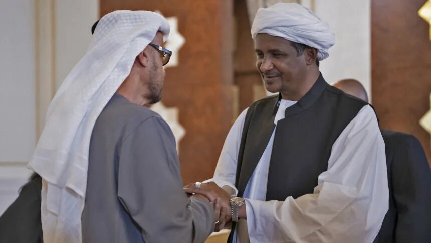 Sudanese RSF leader Mohamed Hamdan Dagalo (R) meets UAE President Mohammed bin Zayed in Abu Dhabi on 15 May 2022 (UAE Ministry of Presidential Affairs/AFP)