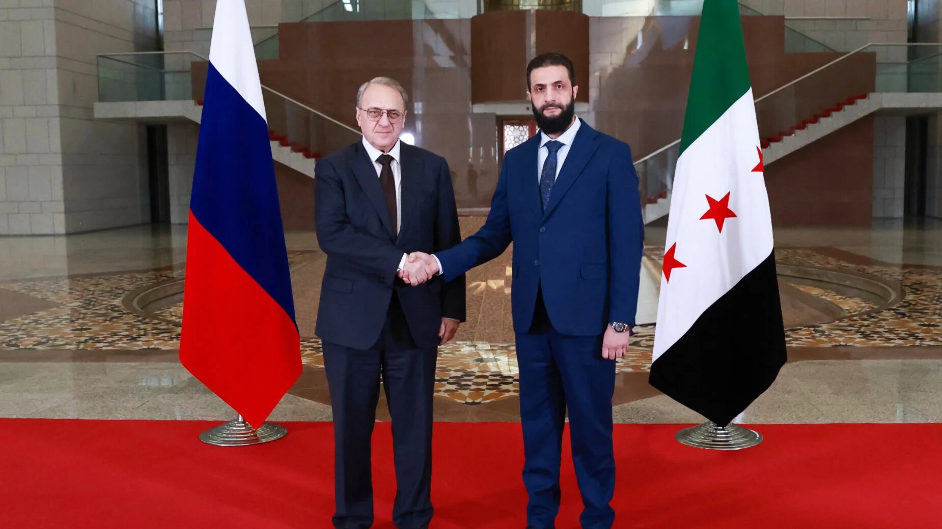 Syrian Interim President Ahmad al-Sharaa with Russia's Deputy Foreign Minister Mikhail Bogdanov in Damascus on 29 January 2025 (Syrian Interim Government/AFP)