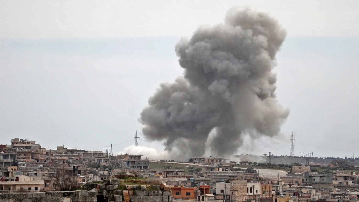 Plumes of smoke rise following Russian air strikes on the village of al-Bara in Syria's Idlib province on 5 March 2020.