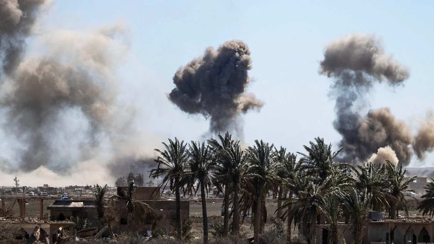 Heavy smoke rises above the village of Baghouz Syria during battles between the Islamic State group and the Syrian Democratic Forces (SDF) on 18 March 2019.
