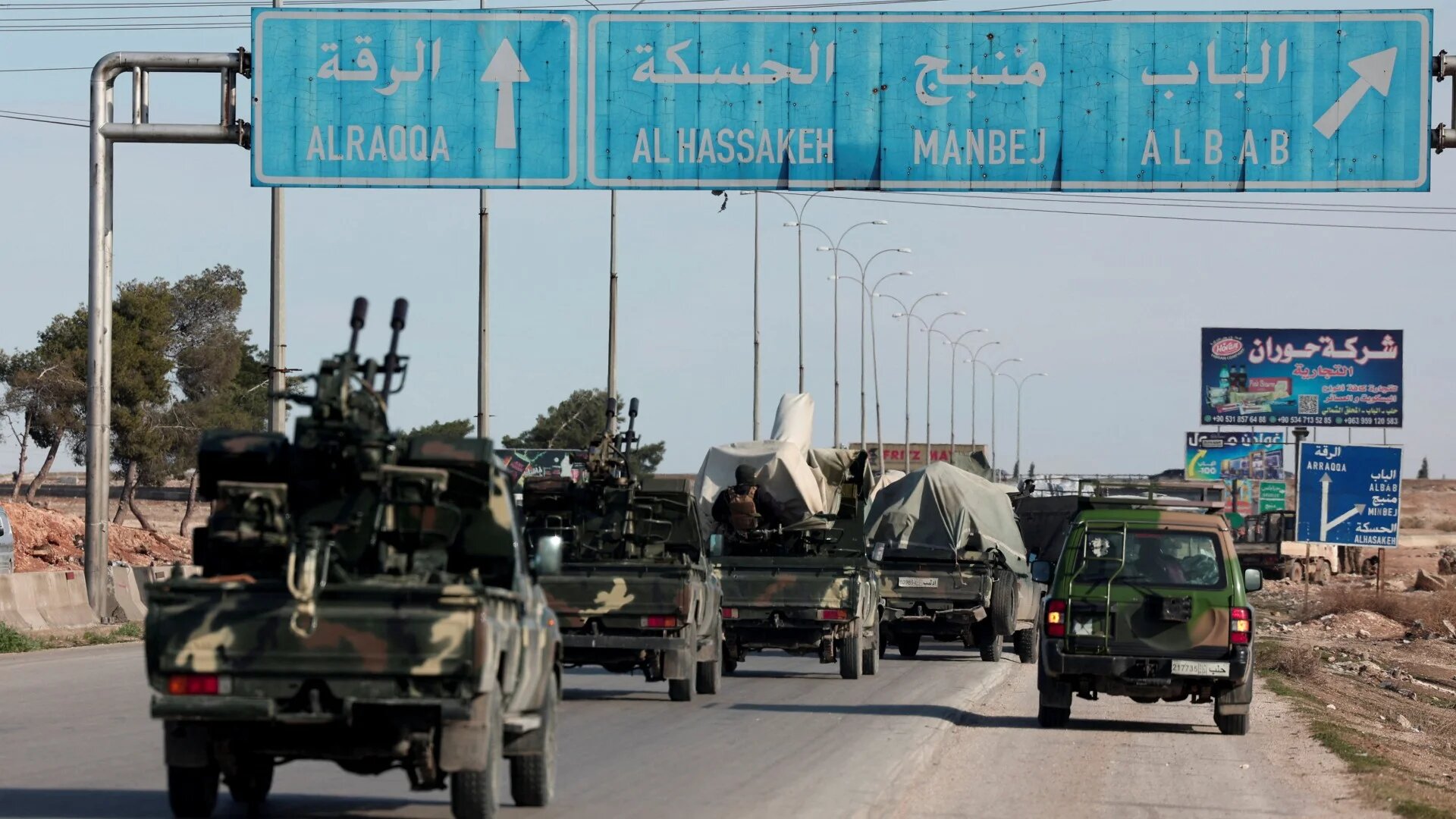 Syrian army reinforcements deploy to the Dayr Hafir front, where the SDF controls its last remaining foothold on the western bank of the Euphrates River, on 14 January 2026 (Mahmoud Hassano/Reuters)