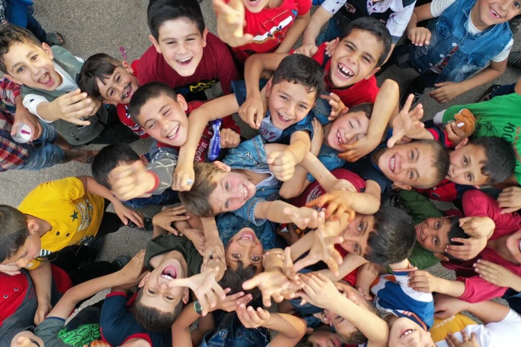 Syrian children play in a makeshift playground to mark Eid al-Fitr (AFP)