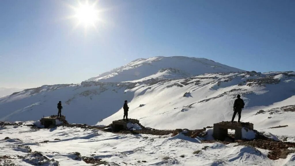 Syrian soldiers stand on Mount Hermon on 25 January 2021 (SANA/AFP)