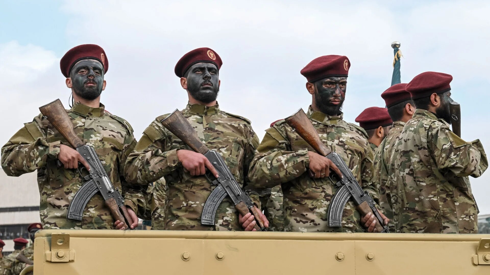 Military personnel during a parade as people gather to celebrate a year since the ousting of longtime ruler Bashar al-Assad in the Syrian capital Damascus on 8 December 2025 (AFP/Louai Beshara)