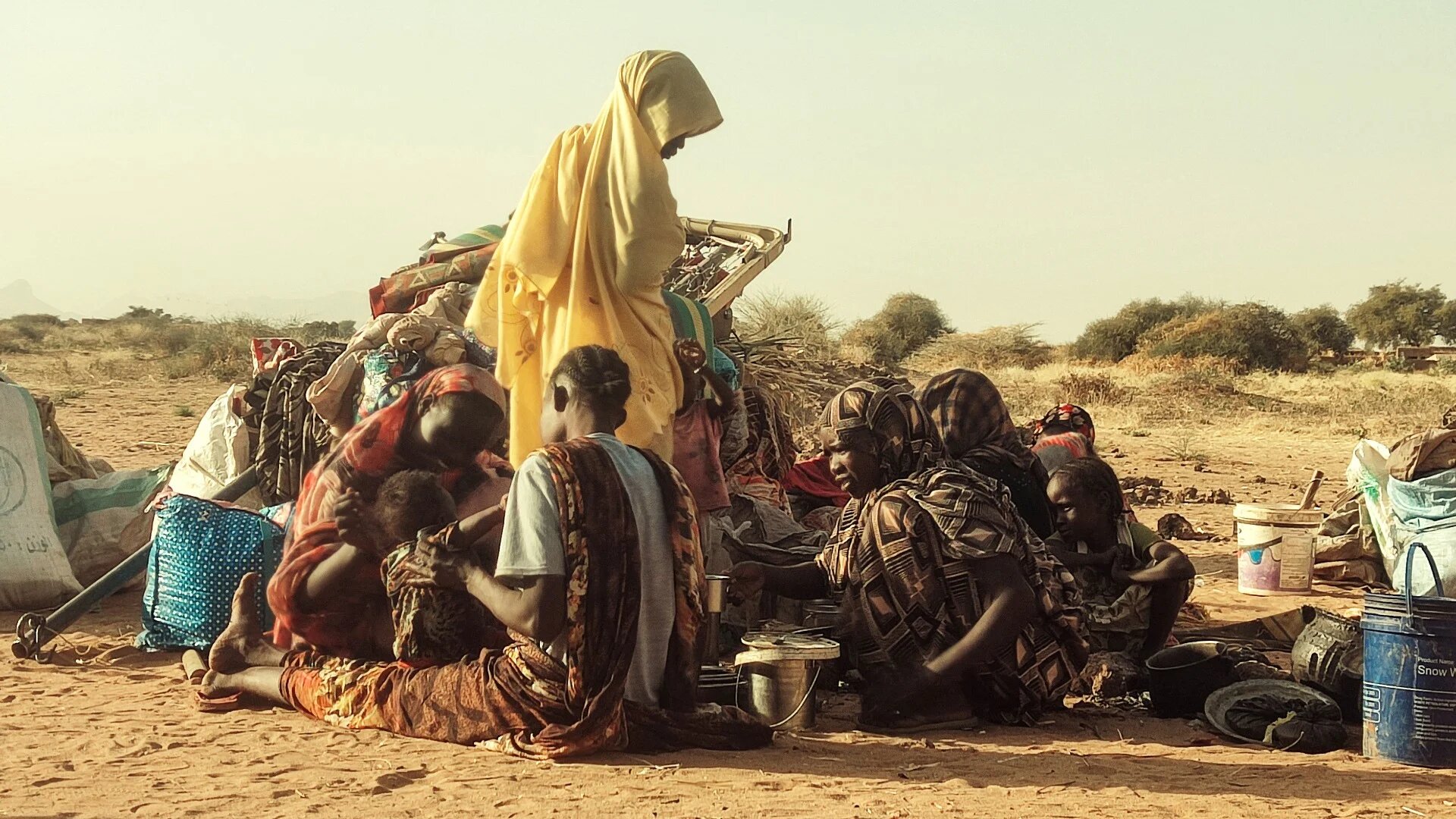 Displaced Sudanese, who fled the Zamzam camp, gather near the town of Tawila in North Darfur on 14 February 2025 (AFP)