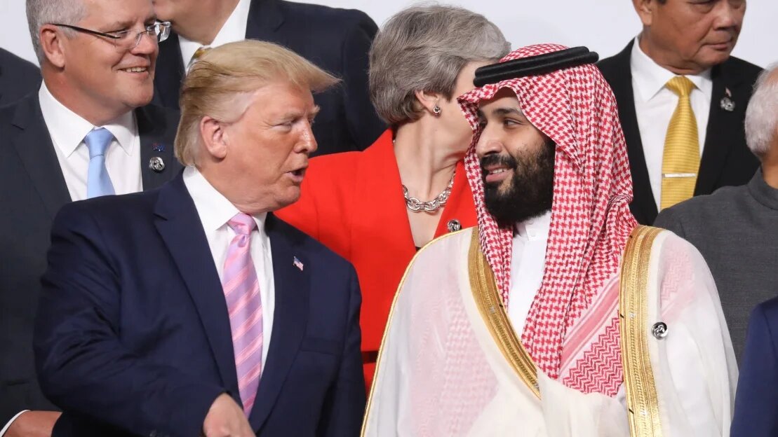 US President Donald Trump and Saudi Arabia's Crown Prince Mohammed Bin Salman speak during the family photo at the G20 Osaka Summit in Osaka on 28 June 2019.