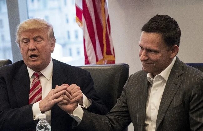 Donald Trump with Peter Thiel during a meeting with technology executives at Trump Tower in New York City in December 2016 (AFP)