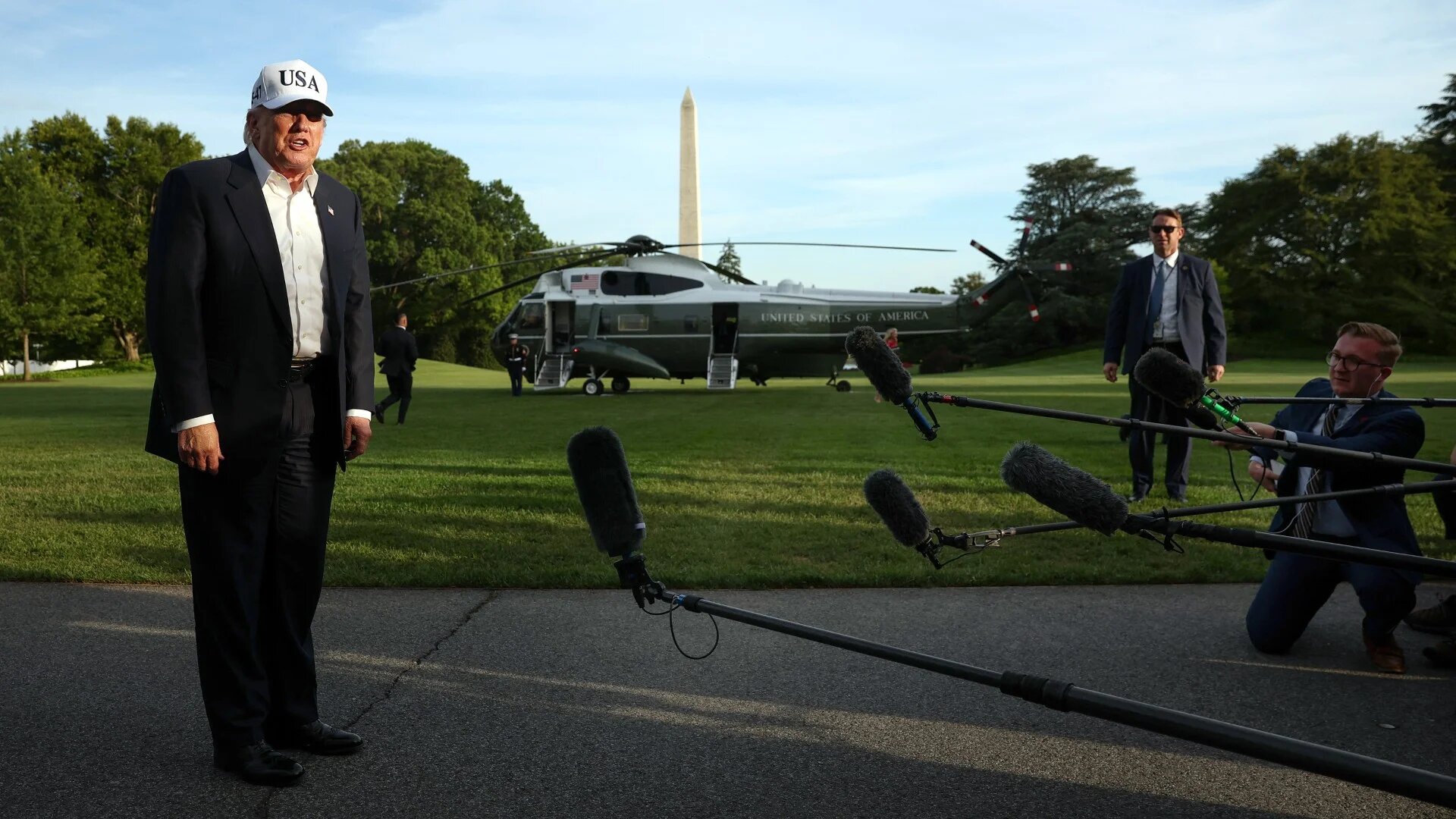 US President Donald Trump speaks to members of the media after returning to the White House in Washington on 15 May 2026 (Kevin Dietsch/Getty Images via AFP) 