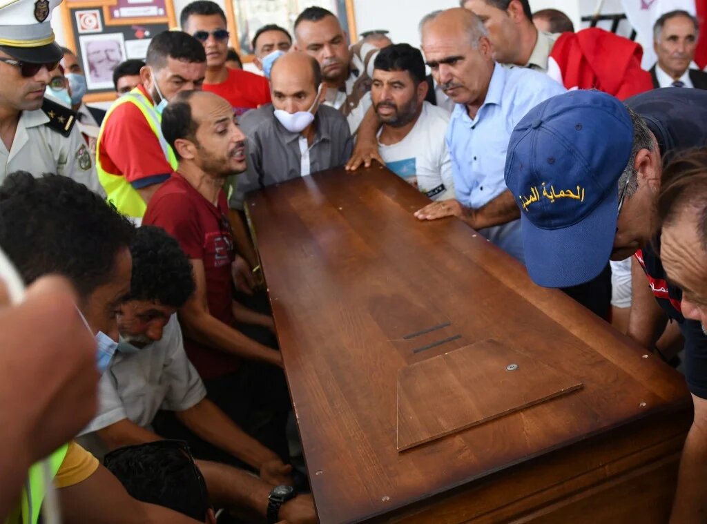 Members of the Tunisian National guard carry the coffin of a fellow officer after he was killed in an attack in the city of Sousse.