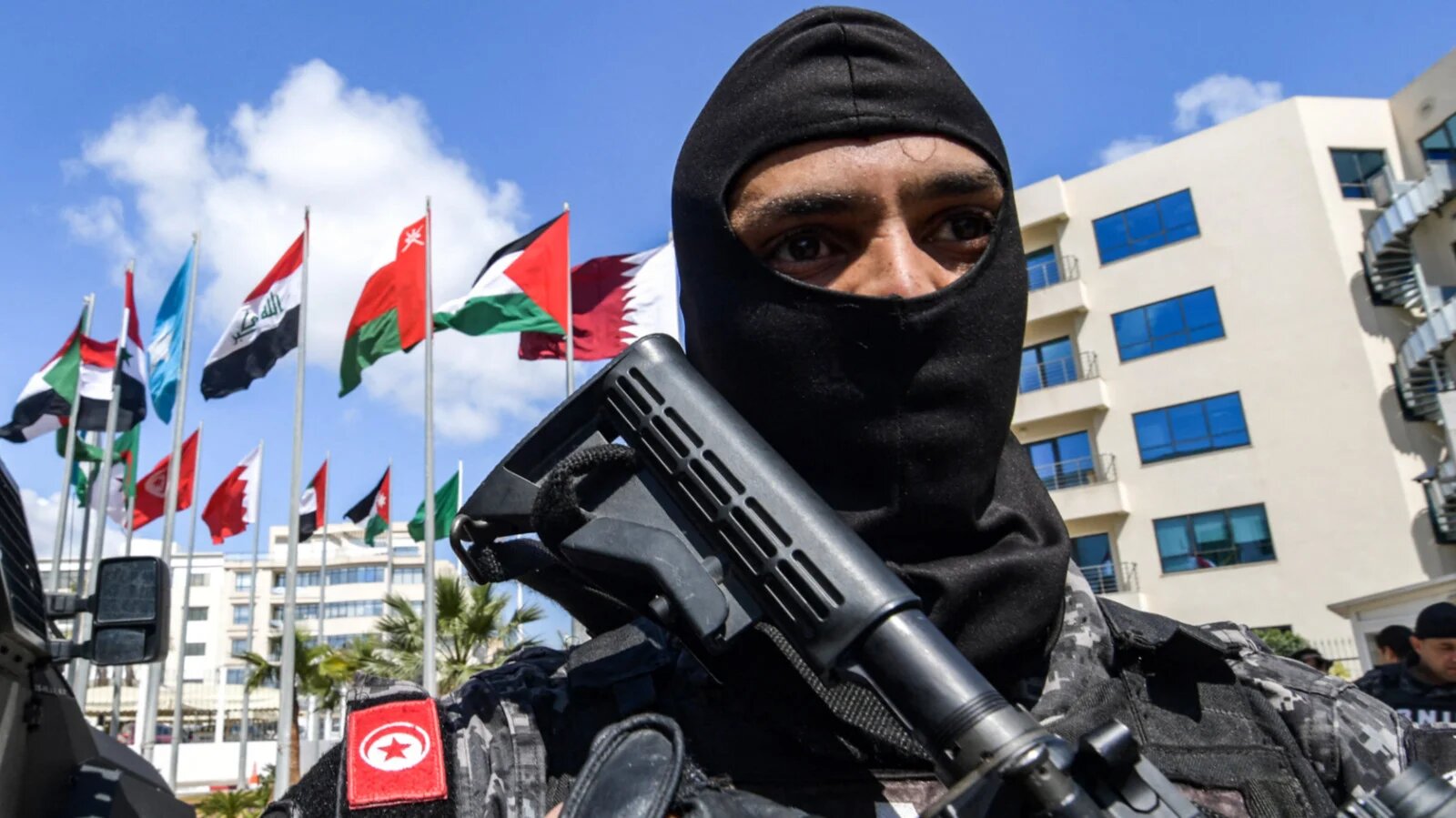 Tunisian security forces stand guard outside the AIMC HQ in Tunis, Tunisia in March 2019 (AFP)