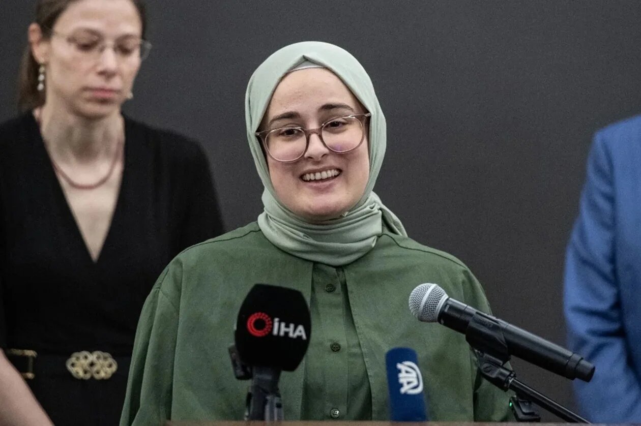 Rumeysa Ozturk speaks at a press conference at Logan International Airport in Boston, Massachusetts, on 10 May 2025 (Joseph Prezioso/AFP)
