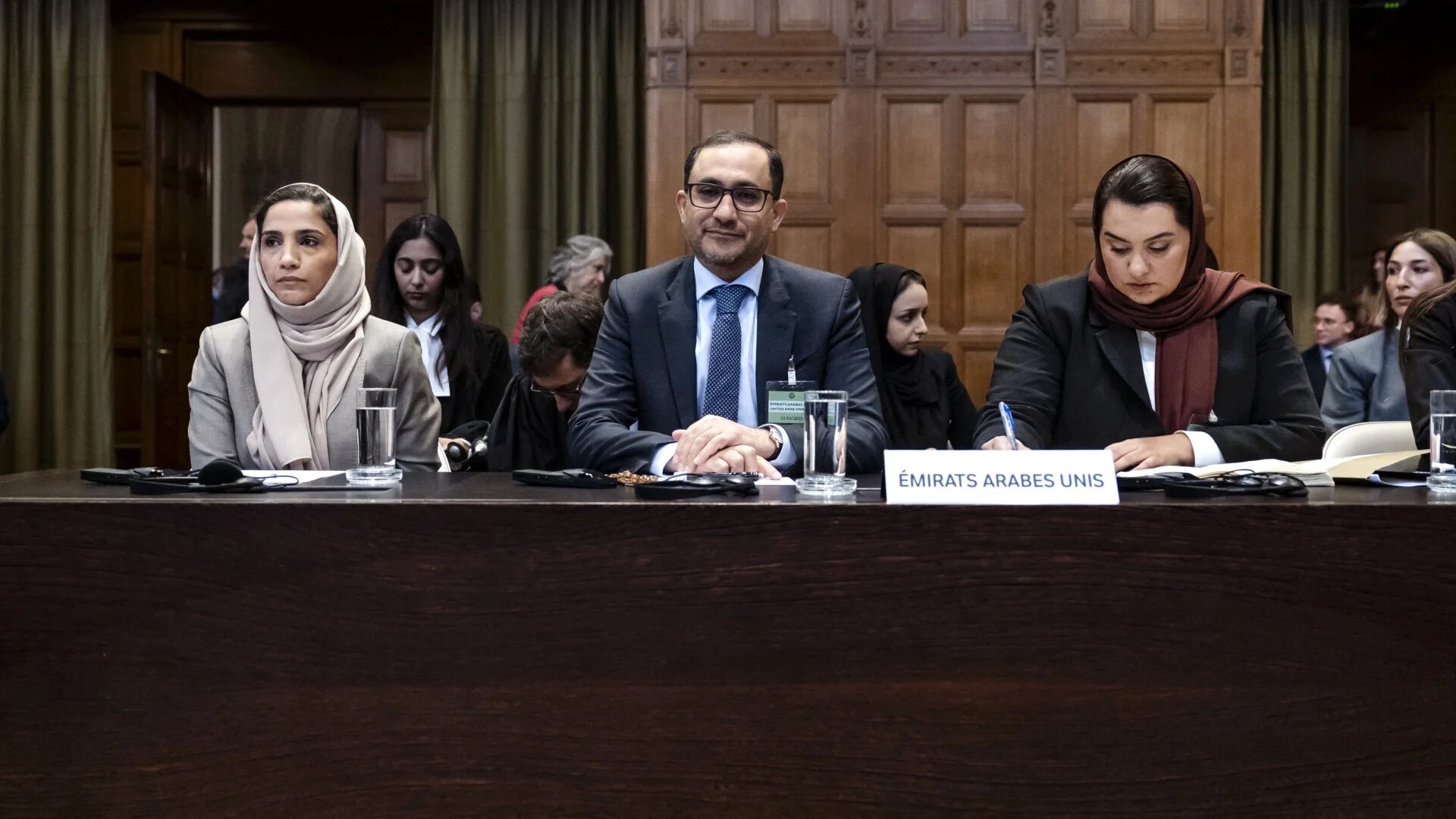 The United Arab Emirates delegation waits for the start of a hearing before the International Court of Justice in The Hague, on 10 April (Remko de Waal/ANP/AFP)