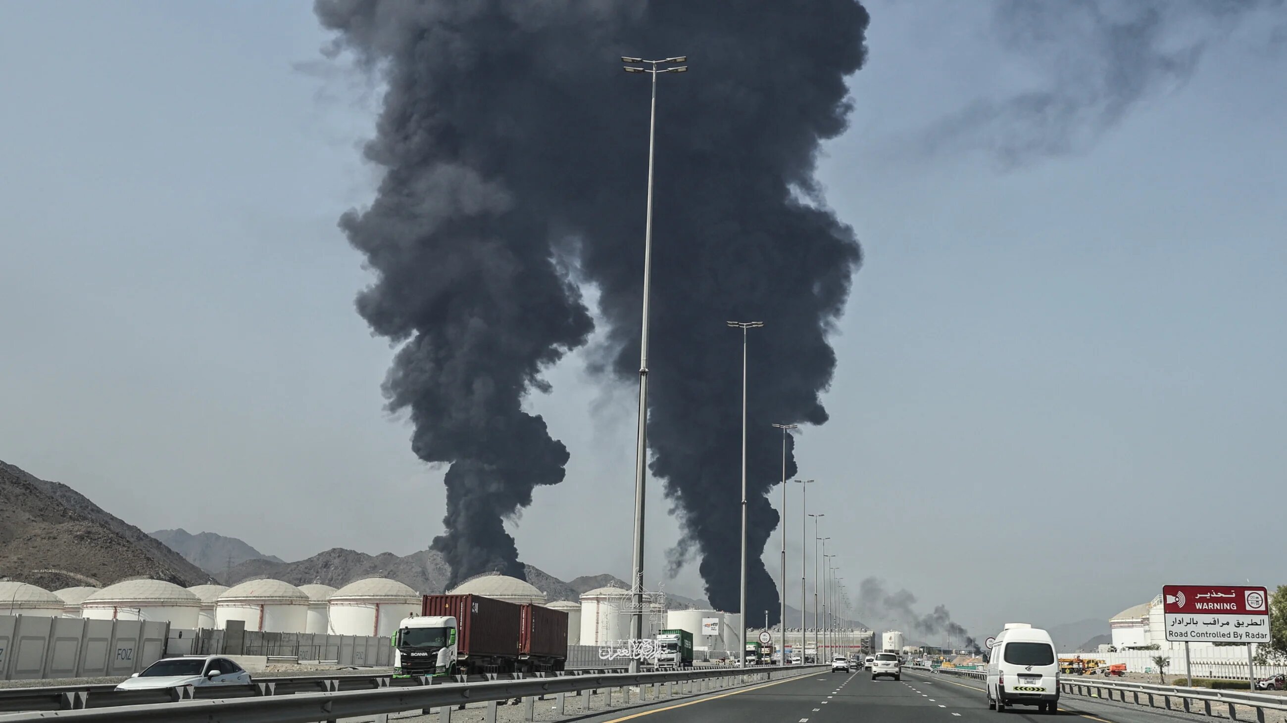 Smoke rises from the direction of an energy installation in the Gulf emirate of Fujairah on 14 March 2026 (AFP)