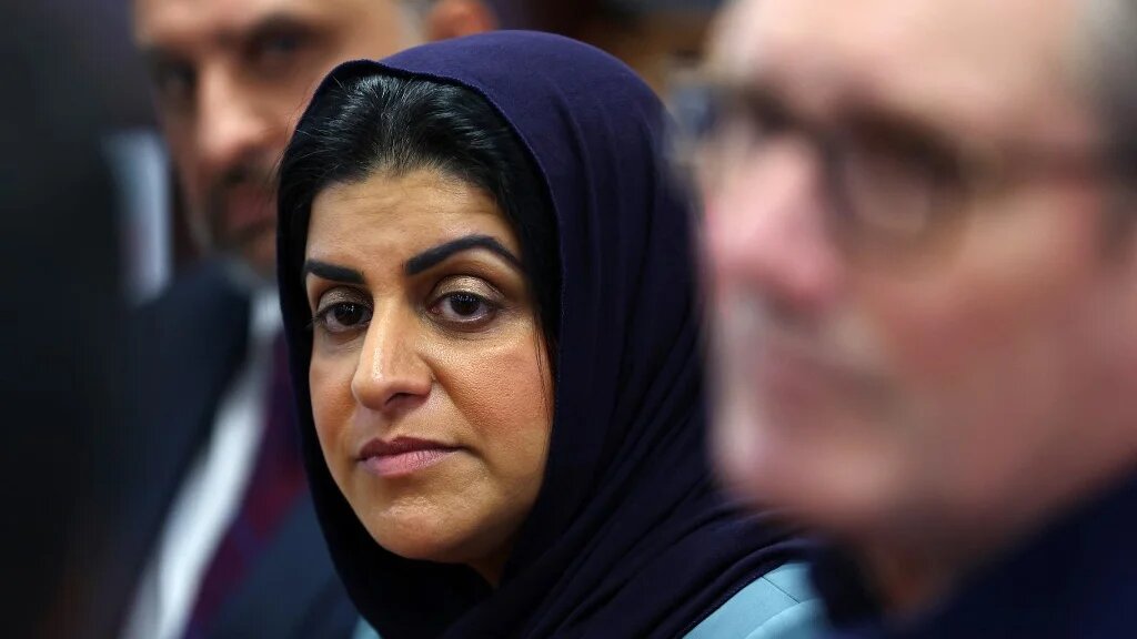 British Home Secretary Shabana Mahmood is pictured with Prime Minister Keir Starmer during a visit to a mosque in southern England, on 23 October 2025 (Peter Nicholls/AFP)